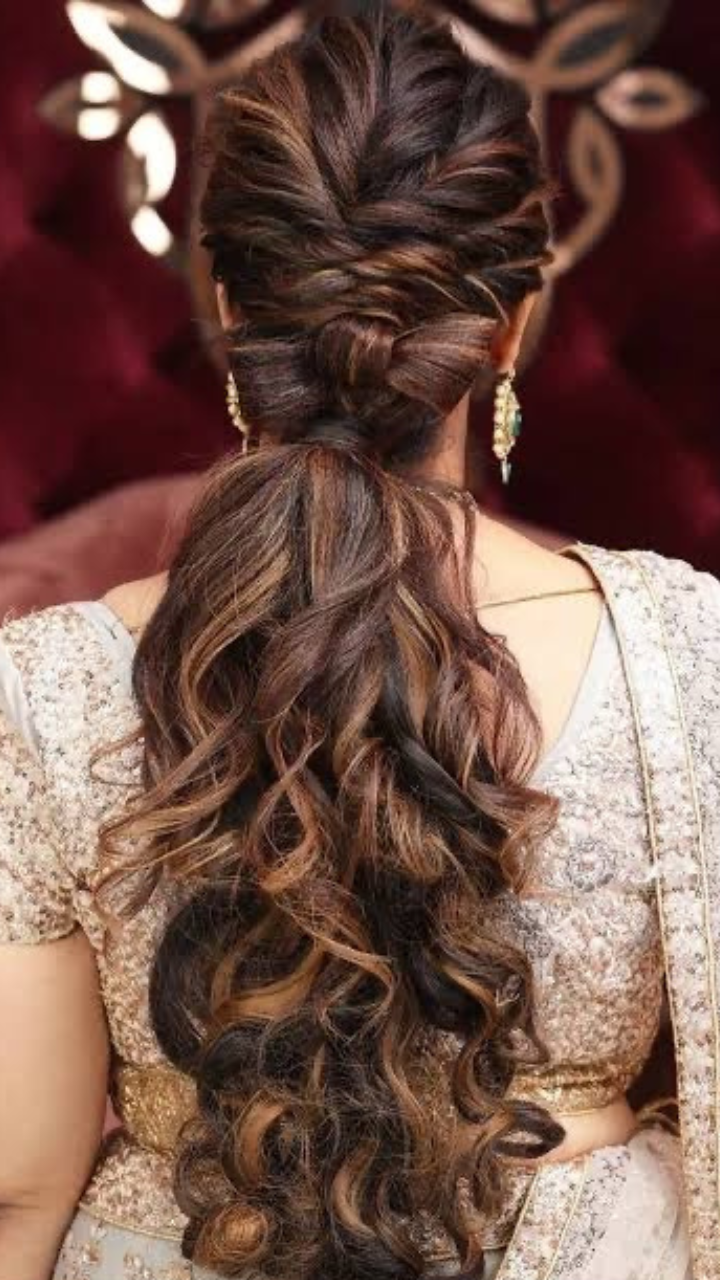 modern-low-ponytail-with-curls-indian-reception-bridal-hairstyle | WedAbout