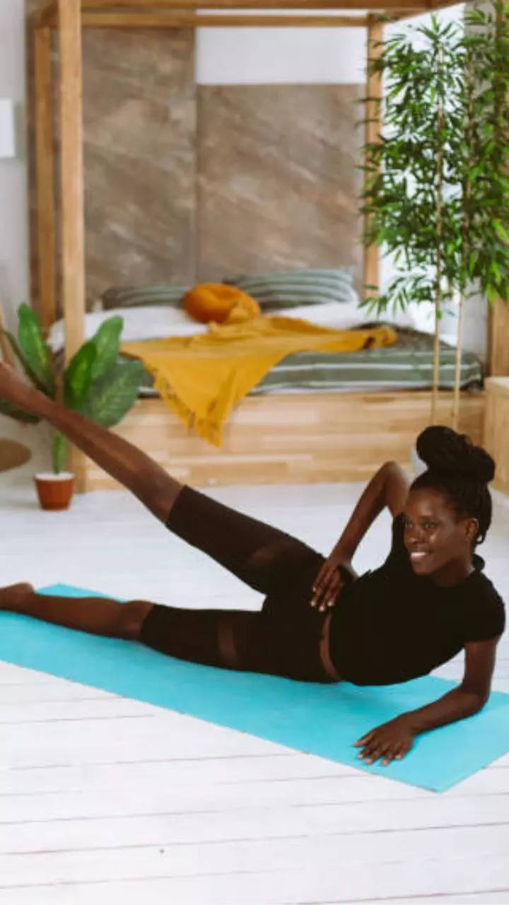 Woman Doing Raised Legs Pose Uttanpadasana During Group Yoga Stock Photo -  Download Image Now - iStock