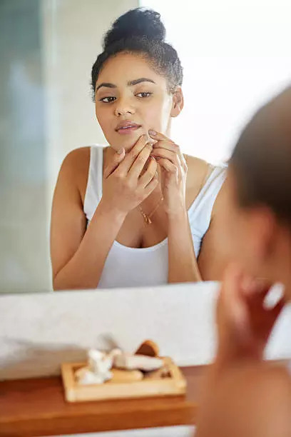 Avoid touching pimples