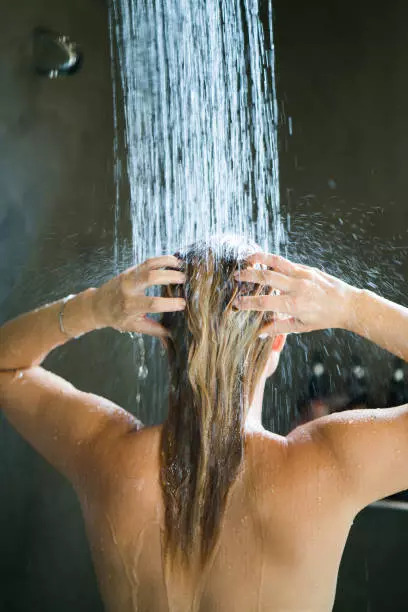 Washing hair with hot water