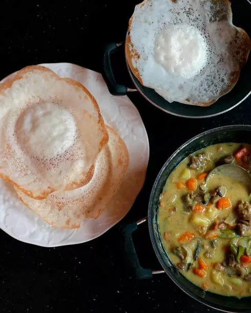 Appam with vegetable stew