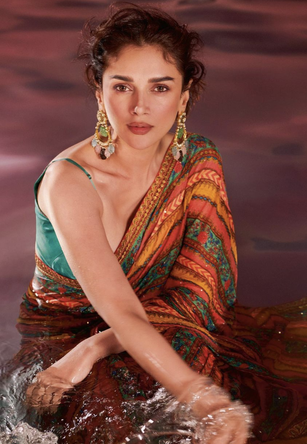 Multi-hued saree with a deep-cut blouse