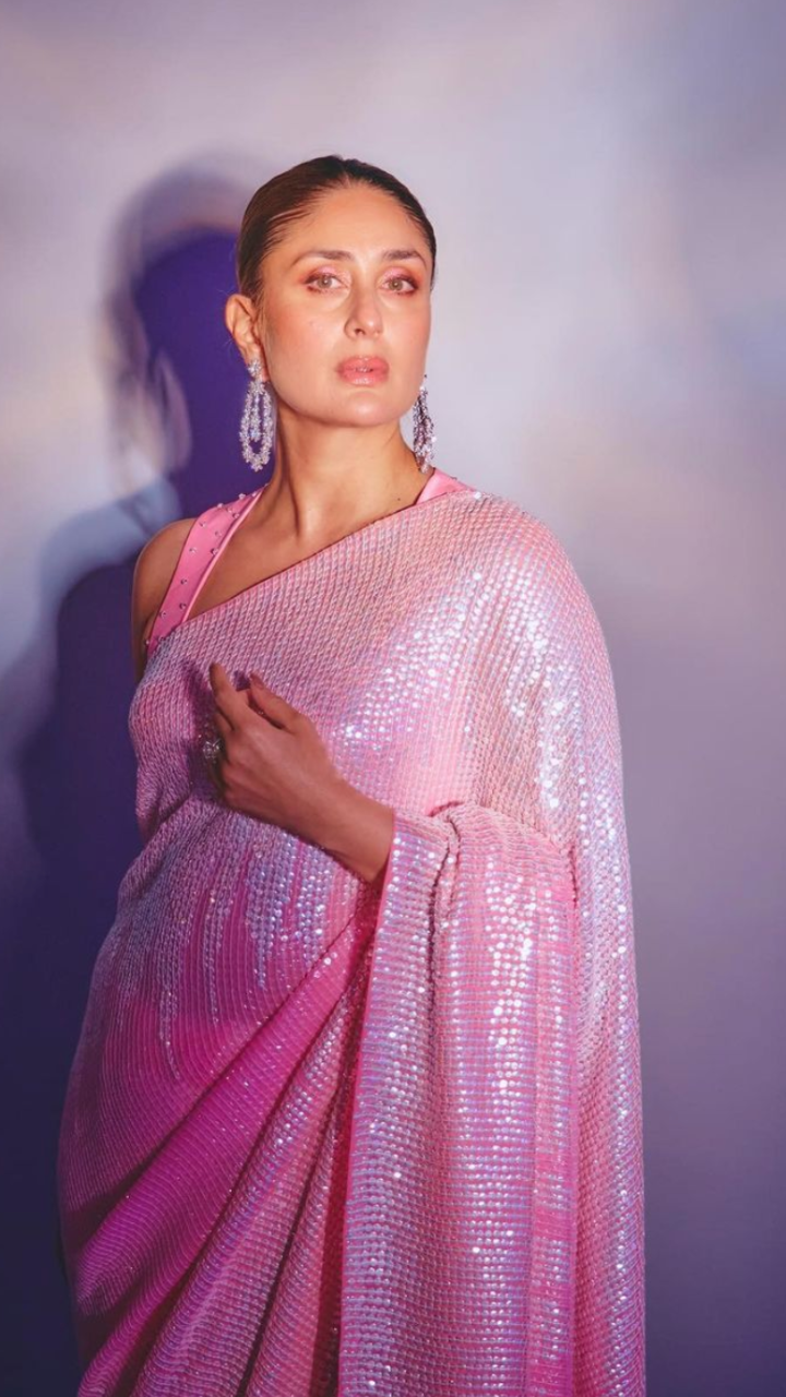 Fairy in pink sequinned saree with a strappy blouse