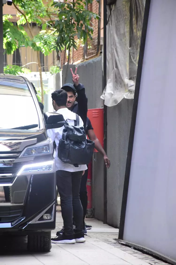 Anil Kapoor waved and posed for the cameras as he was clicked 