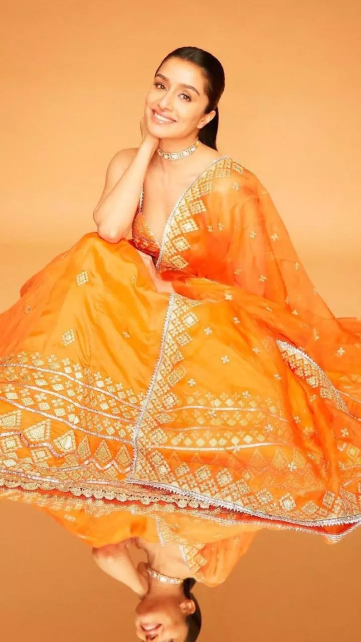 Coral-hued lehenga with mirror-work