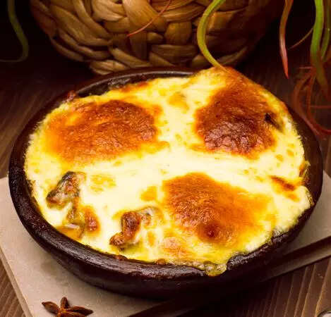 Delicious cheesy baked eggs Pic Credit Freepik