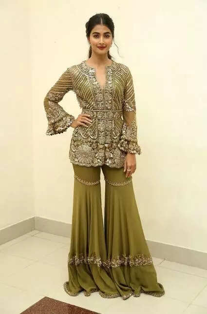 Pooja Hegde looks gorgeous in an olive-green peplum outfit Pic Credit Pinterest