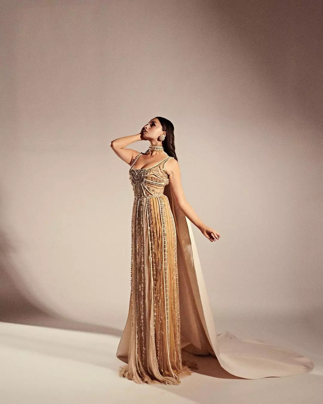 Looks stunning in golden embellished gown