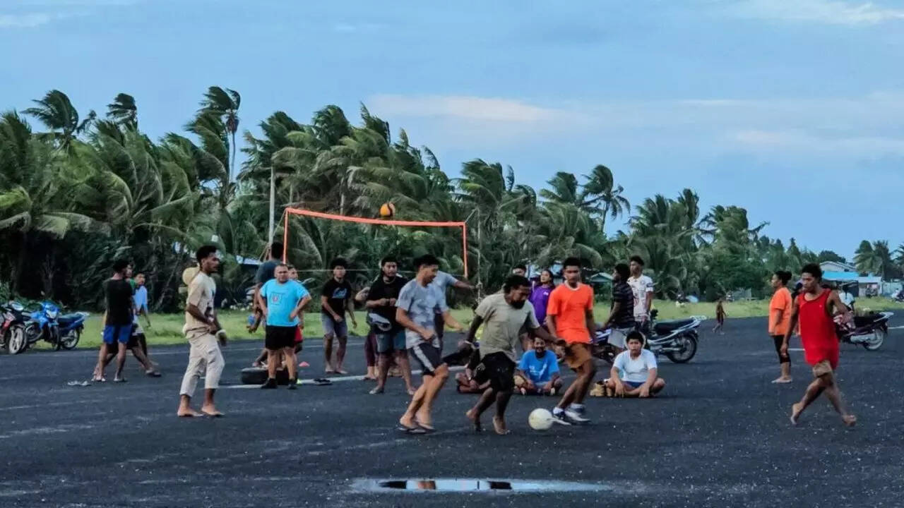 Every evening hundreds of people gather on the airport runway to play games