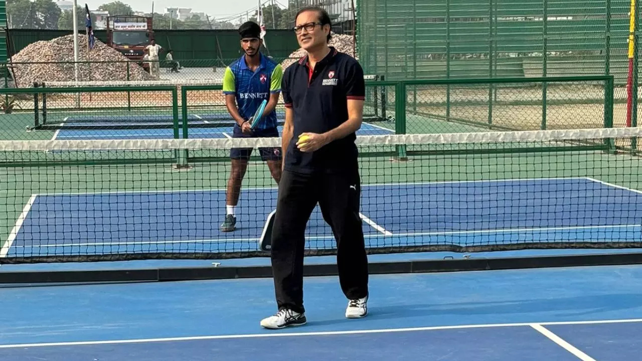 Vineet Jain plays with a Bennett University student