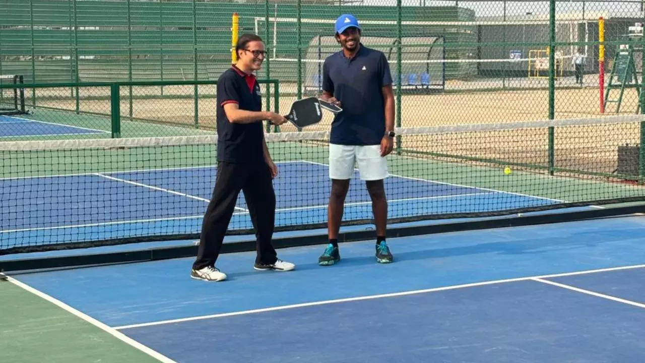 ARMAAN Bhatia with Times Group MD Mr Vineet Jain after the exhibition match