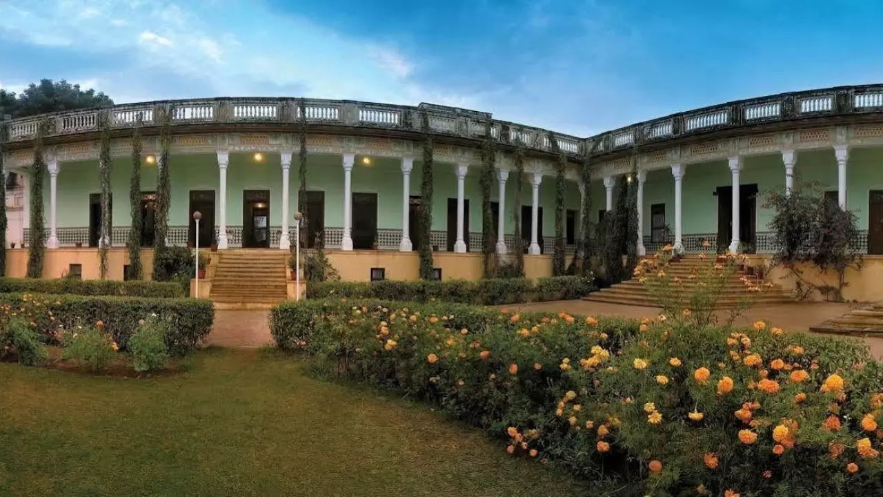 The royal retreat features frescoed courtyards a sprawling garden and a historic entrance gate built for the Maharaja of Jaipur by Seth Piramal