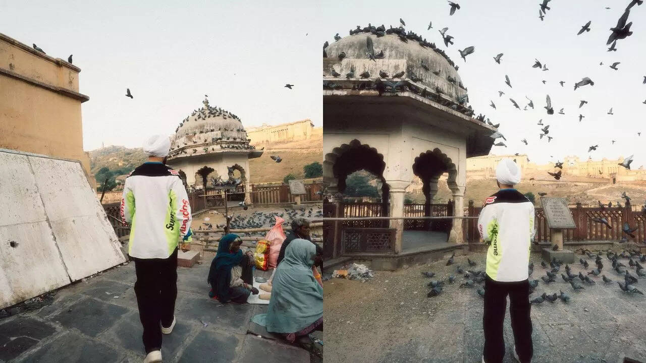 Feeding pigeons in Amer Fort