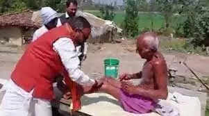 BJP MLA Bhupesh Chaubey goes viral after giving an oil massage to an elderly man