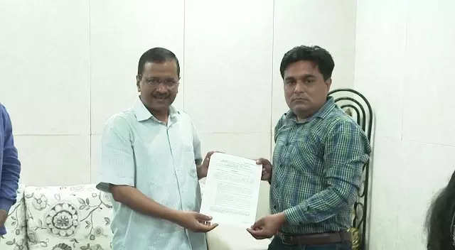 Delhi CM Arvind Kejriwal gives a letter of appointment to the brother of Intelligence Bureau staffer Ankit Sharma