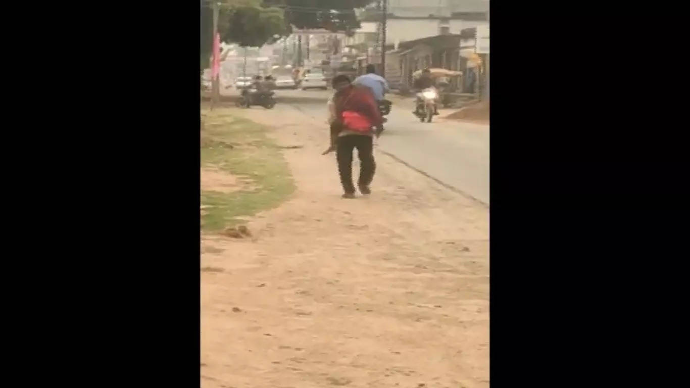 man carries daughter's body