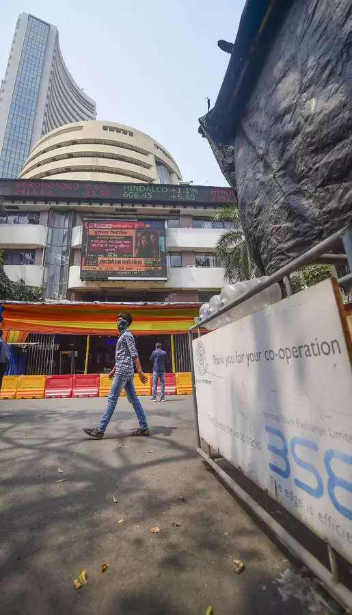 A pedestrian walks past the Bombay Stock Exchange (BSE) building as the ...