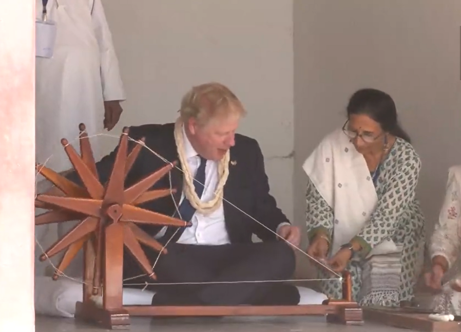 Boris Johnson tries the charkha at Sabarmati Ashram