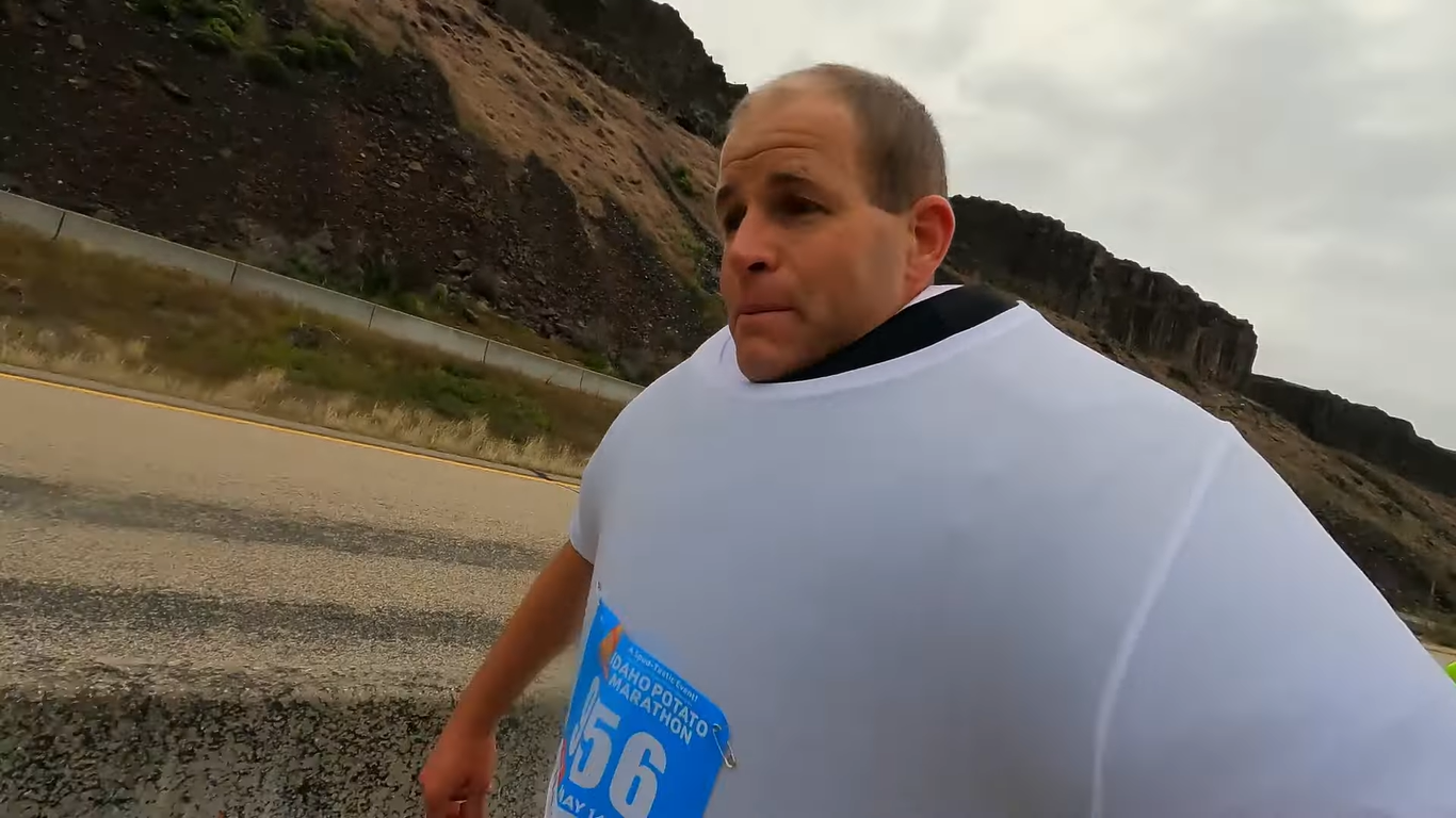 Man competes in half-marathon wearing 111 t-shirts