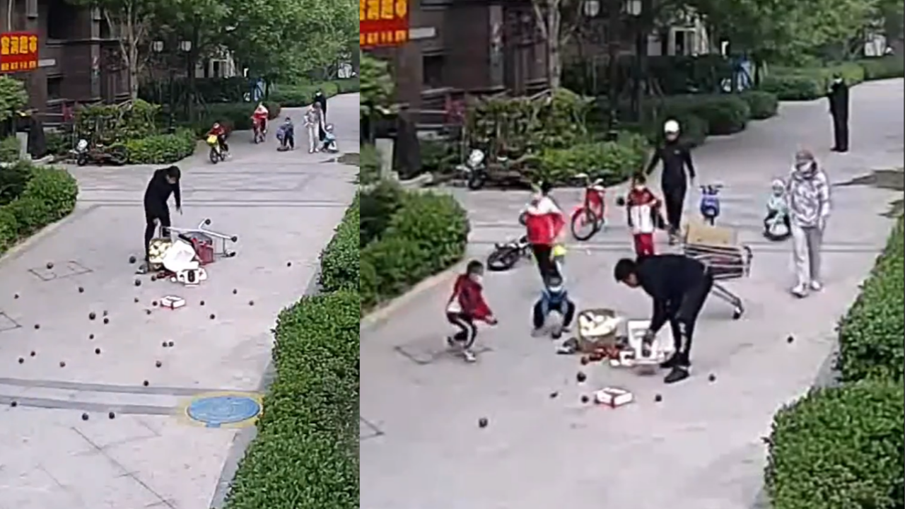 Kids rush to help man who dropped cartons of fruits