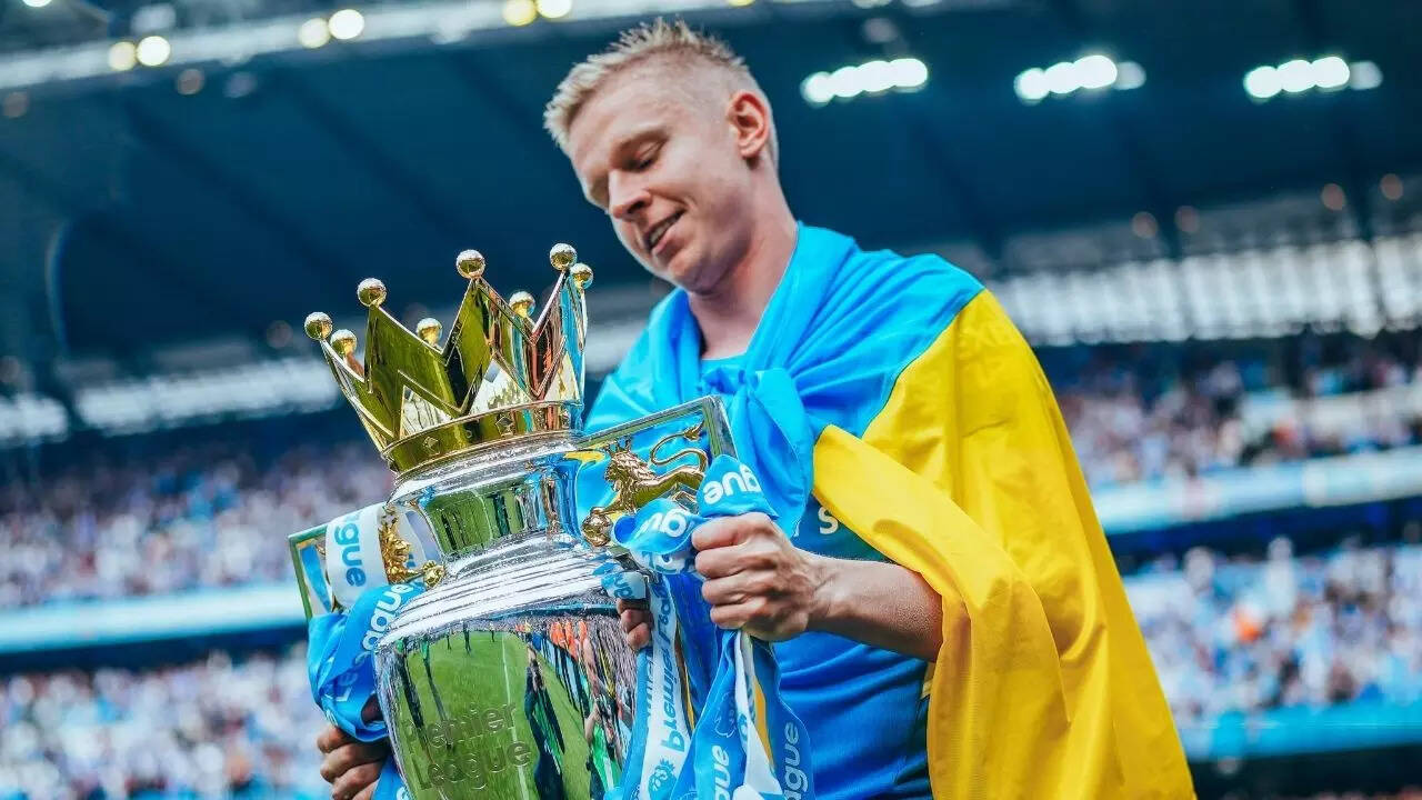 WATCH Zinchenko breaks down after draping PL trophy with Ukraine flag; dedicates title to all