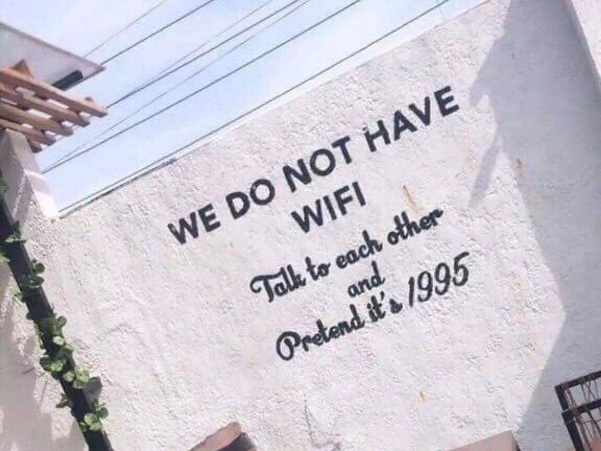 “We do not have WIFI. Talk to each other and pretend it’s 1995,” reads a sign on a cafe wall | Image courtesy: Twitter