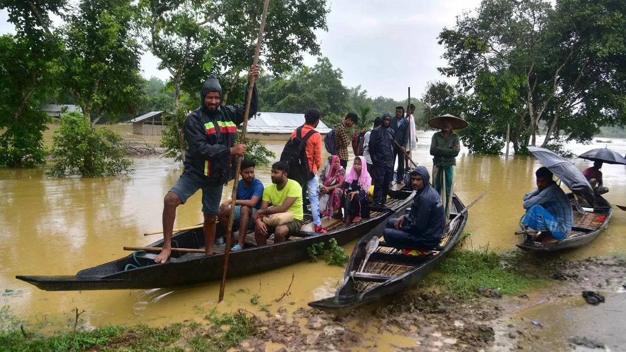 Villagers use boats for moving to safer places in Nagaon District of Assam on June 18,2022​