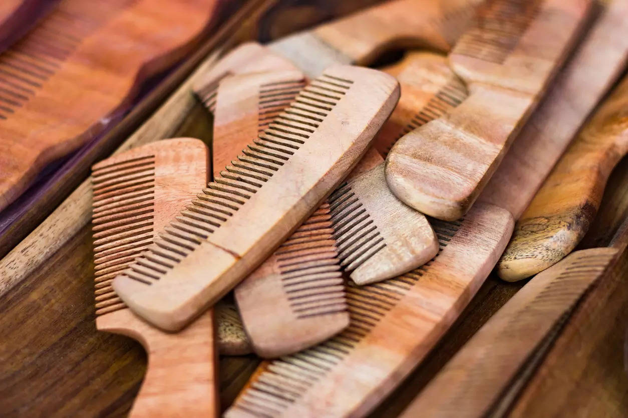 Wooden or plastic? Weigh the benefits of using the right comb for your hair