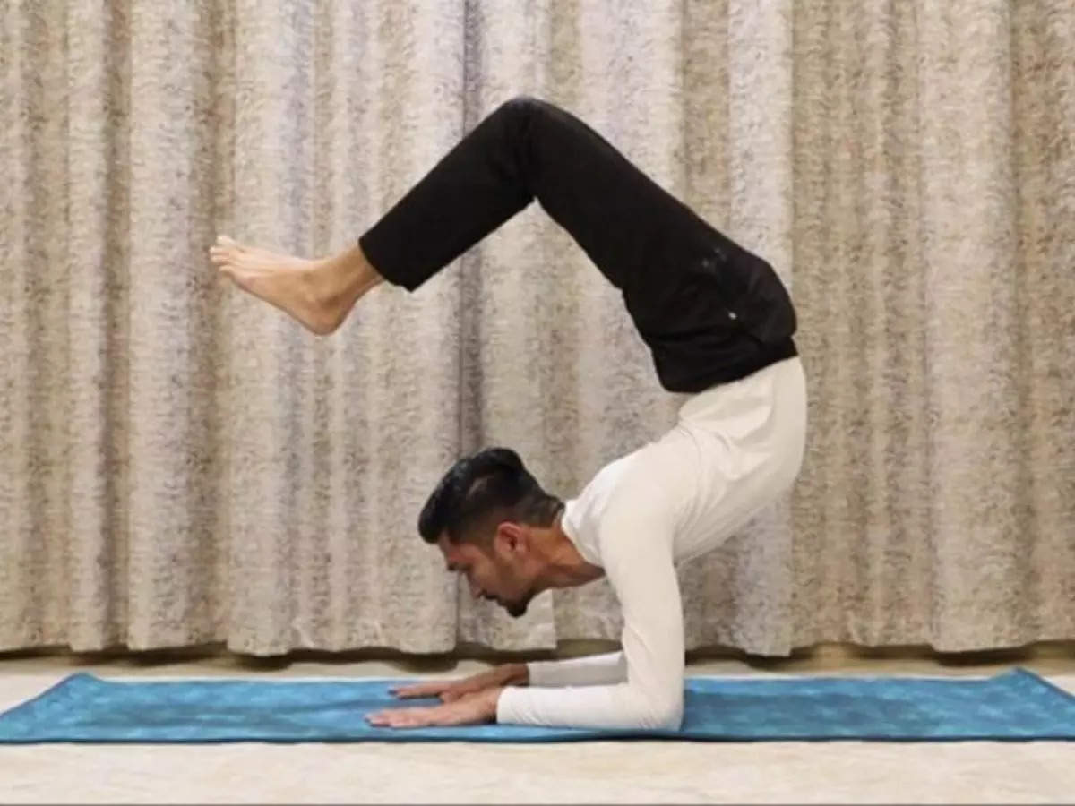 Indian Yoga teacher holds the scorpion position for 29 minutes, 4 seconds, to break a Guinness World Record | Picture courtesy: GWR