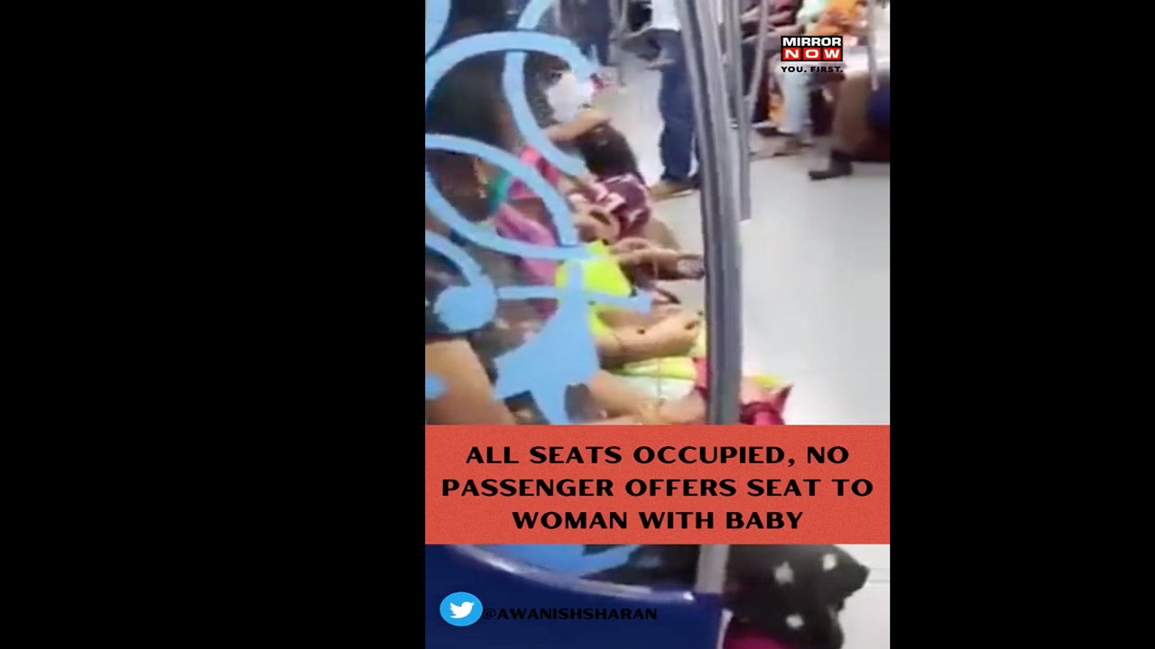 WATCH video of woman sitting on subway floor holding baby goes viral