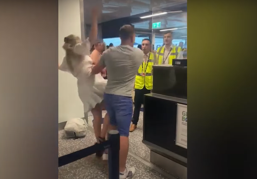 Gone viral Intoxicated passenger shoves girlfriend out of the way to punch airport staff clip surfaces