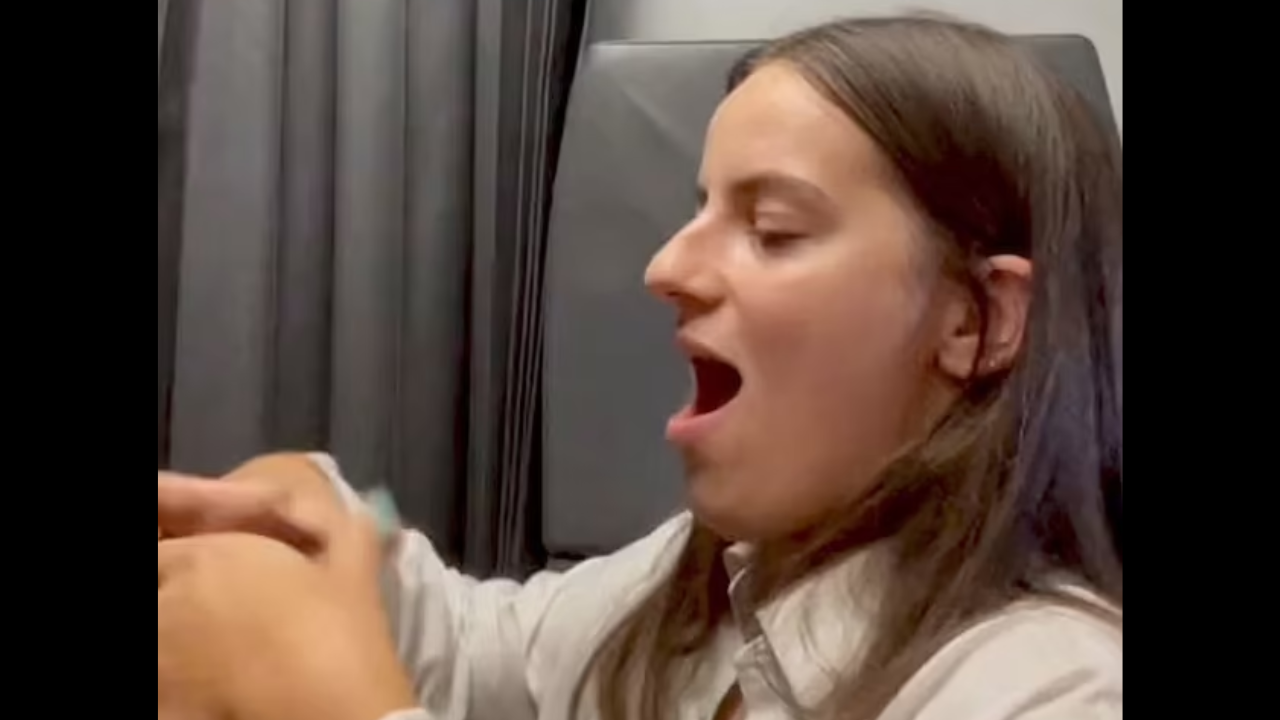 Woman pops her jaw back in place after it dislocated while yawning on plane