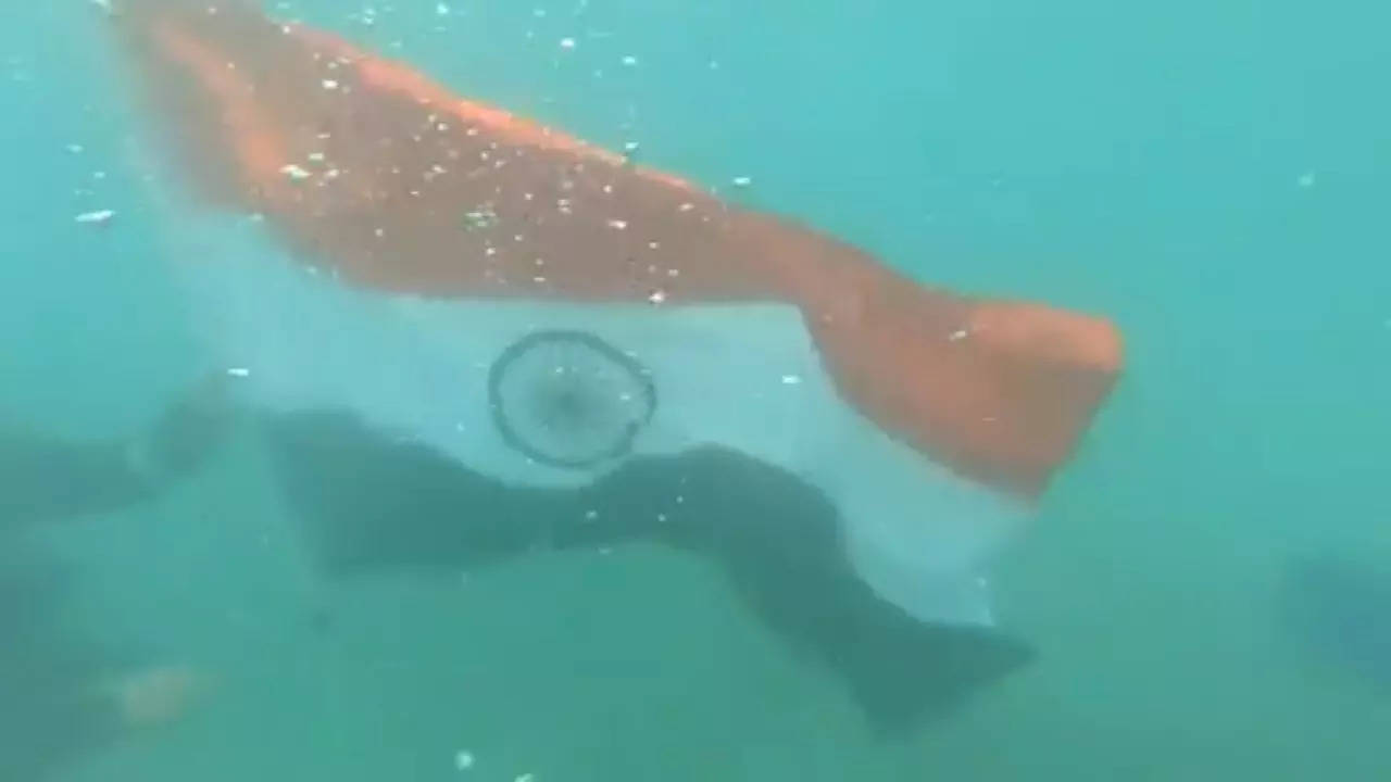 Watch the Indian Coast Guard hoist the flag under water at every home