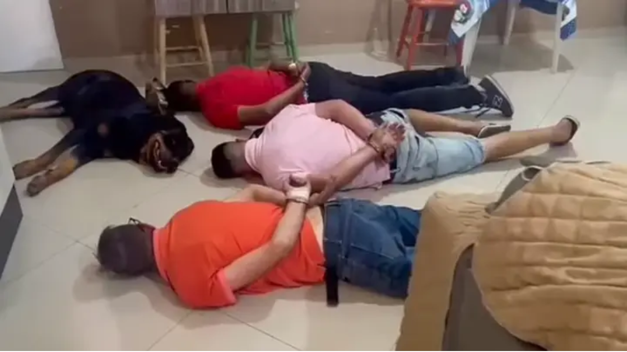 Drug gang watchdog fails at his job lays down next to owners during police raid