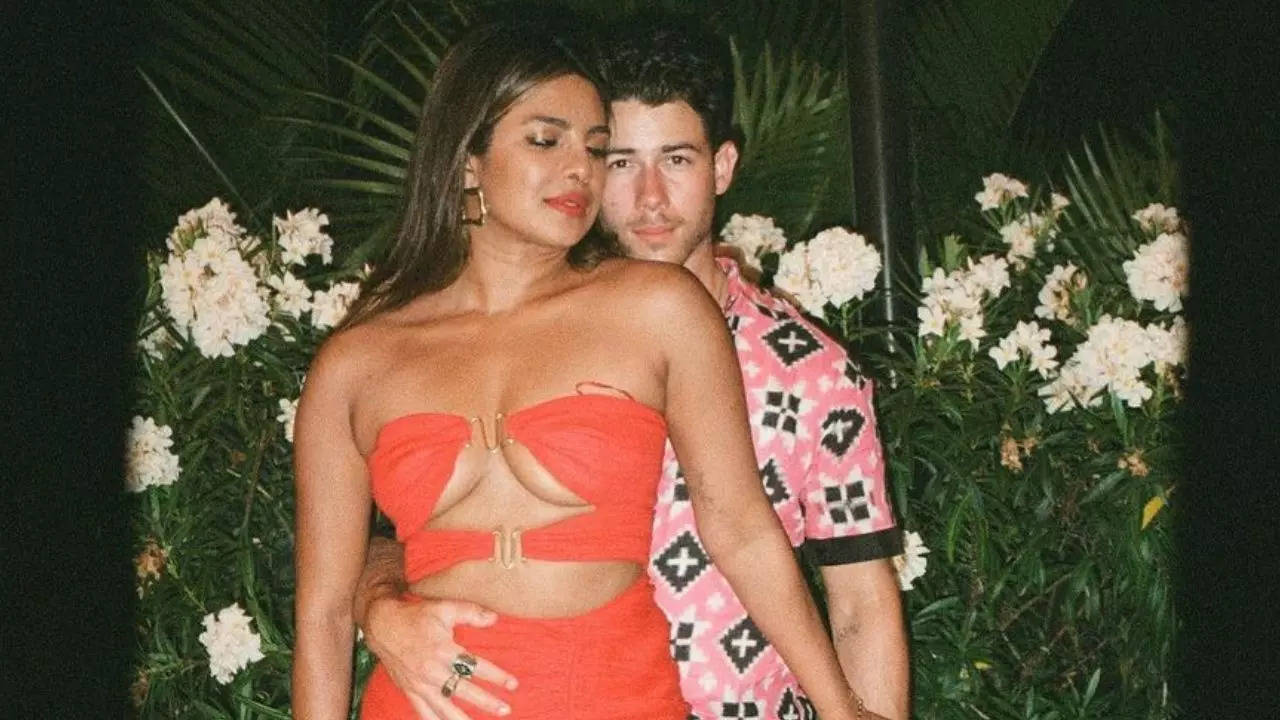 Nick Jonas hugs his lady in red Priyanka Chopra as the two pose in unseen photo from latters birthday