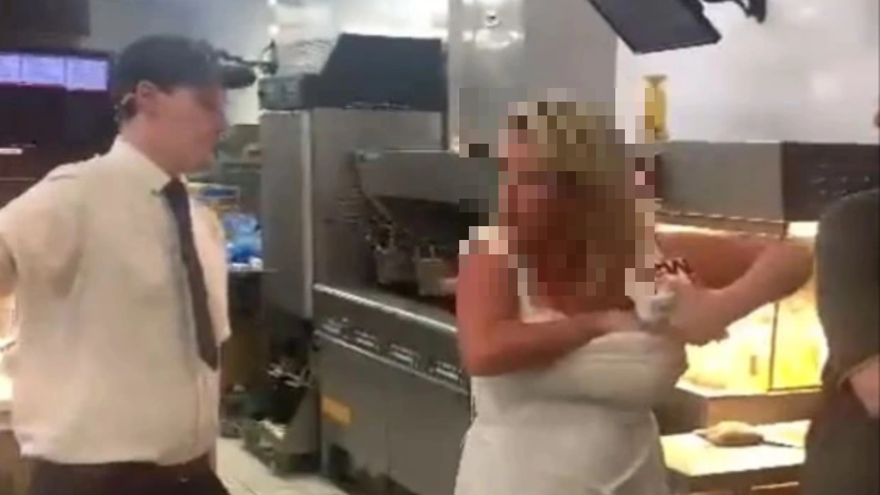 Viral video Woman bursts into McDonalds and stuffs burgers into her dress