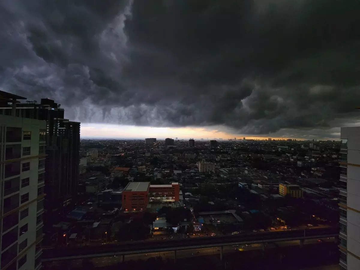 Dark, dense apocalyptic clouds hanging in the sky over Thailand trigger extreme weather alarm
