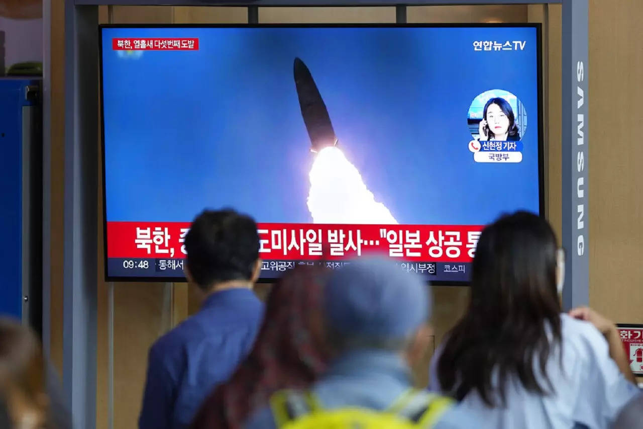 A TV screen showing a news program reporting about North Korea's missile launch with file footage, is seen at the Seoul Railway Station in Seoul