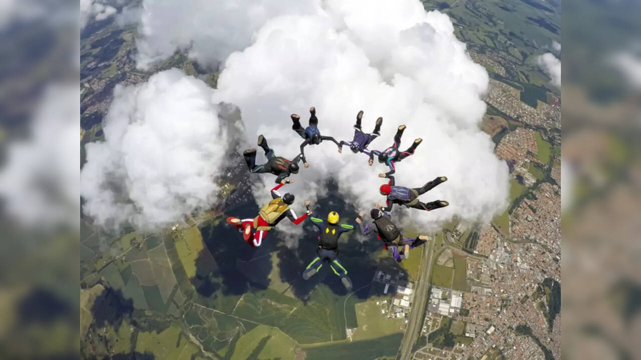 Eight skydivers over 80 years old jump out of plane to break skydiving