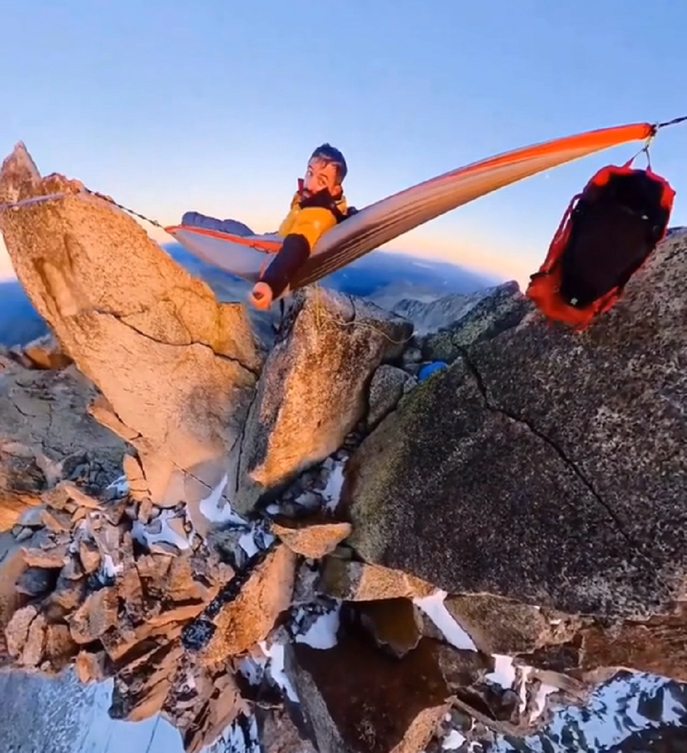 Man movies himself mendacity on a hammock suspended from excessive mountain rocks; netizens in disbelief