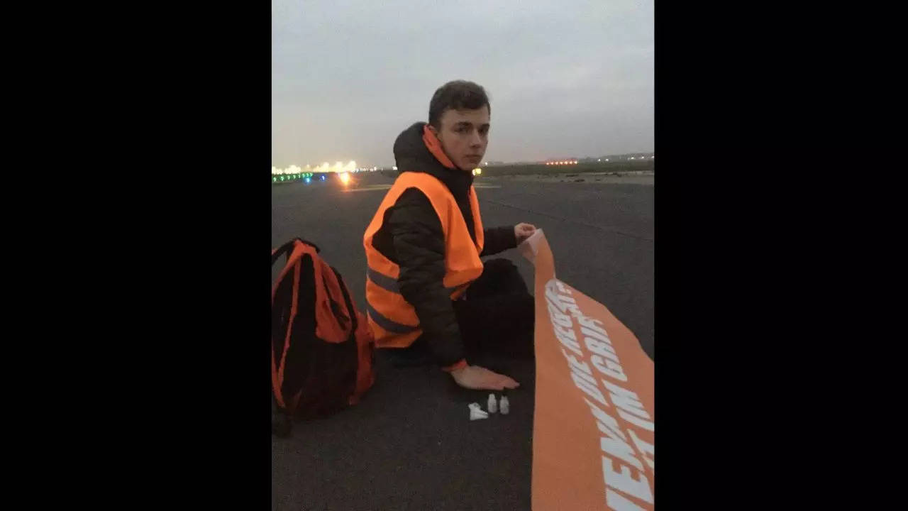 Climate activists shut air traffic at Berlin airport by gluing themselves to the runway