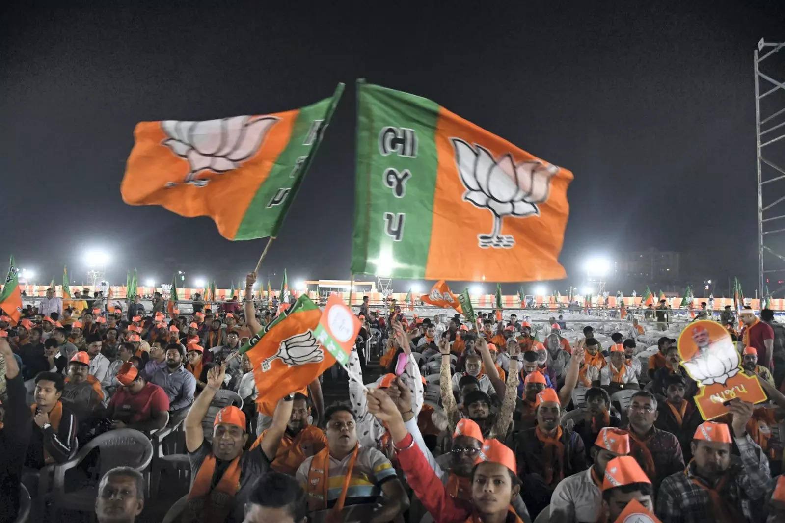 BJP supporters wave party flag during Prime Minister Narendra Modi's public meeting ahead of Gujarat Assembly elections | Representational image