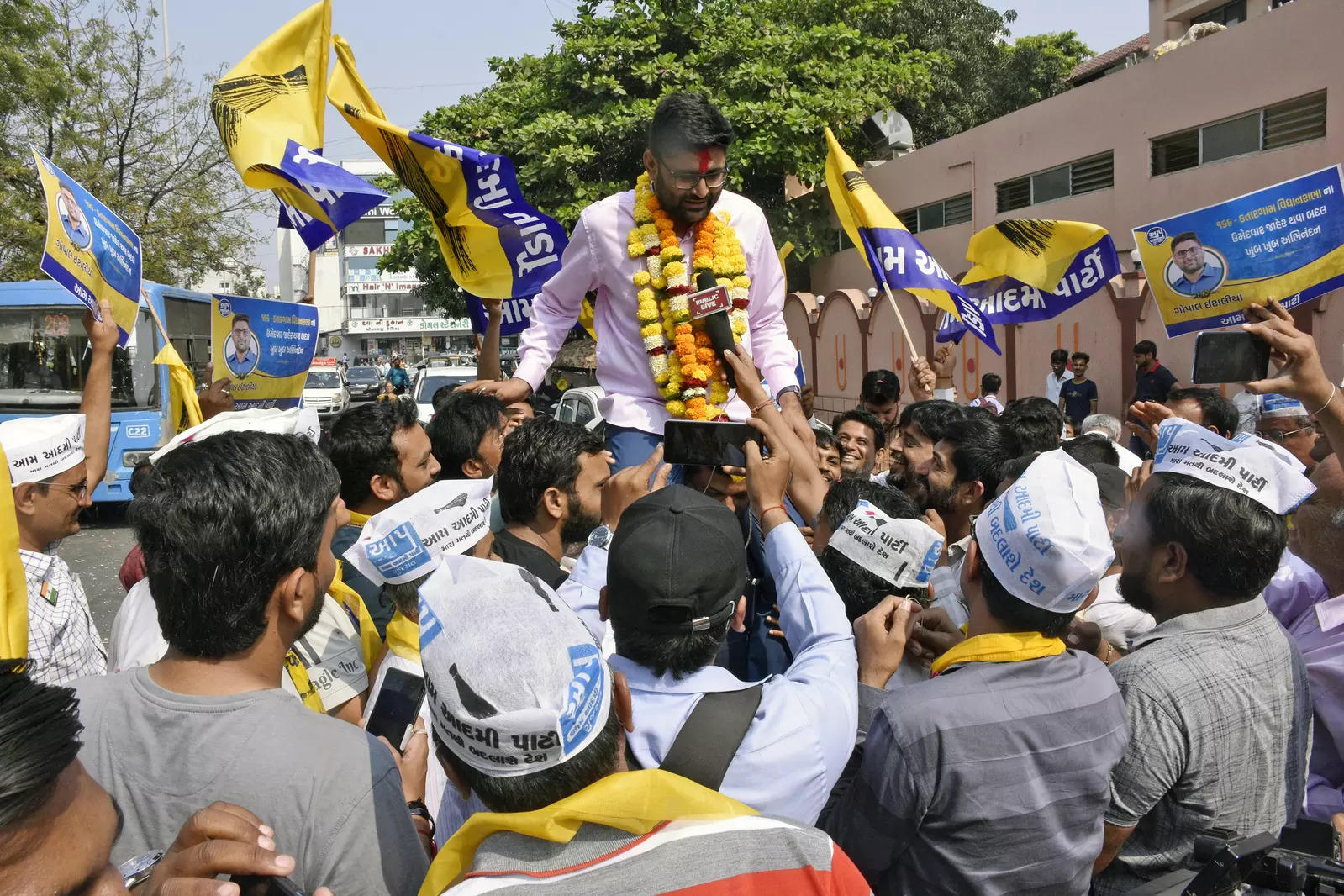 AAP candidate Gopal Italia speaks to media during an election rally at Dabholi Road in Surat