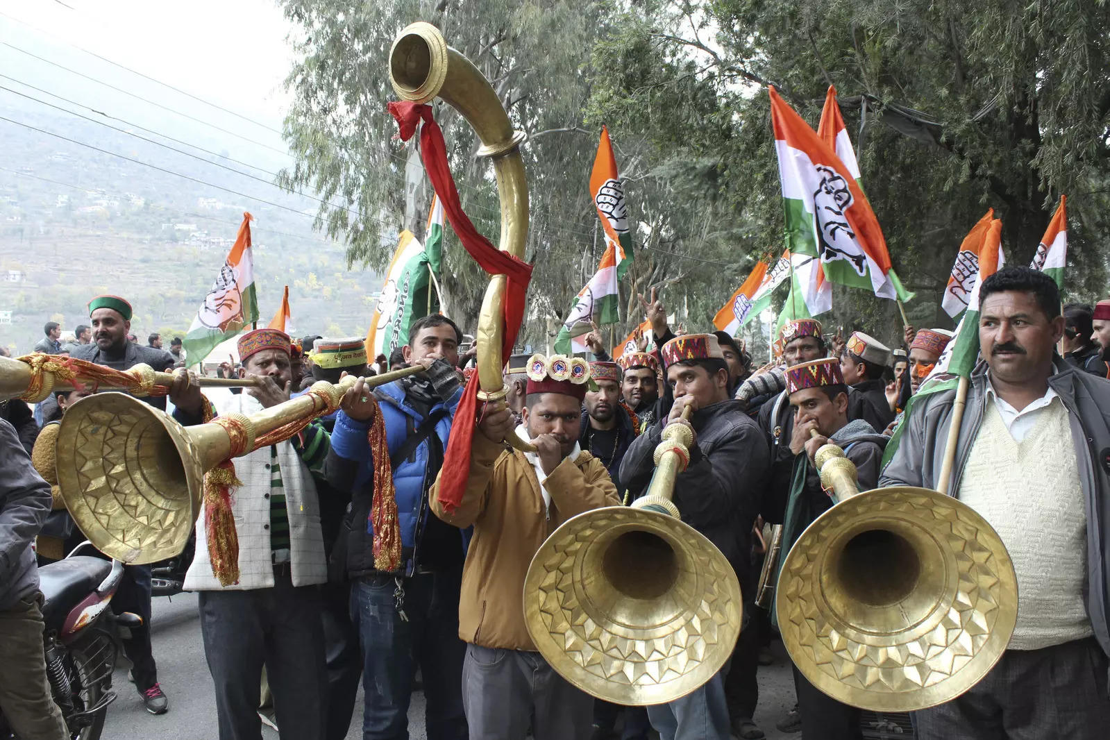 Congress workers celebrate the party's lead in Himachal Pradesh state elections