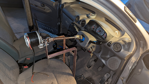 The steering wheel is removed to expose the steering column teeth