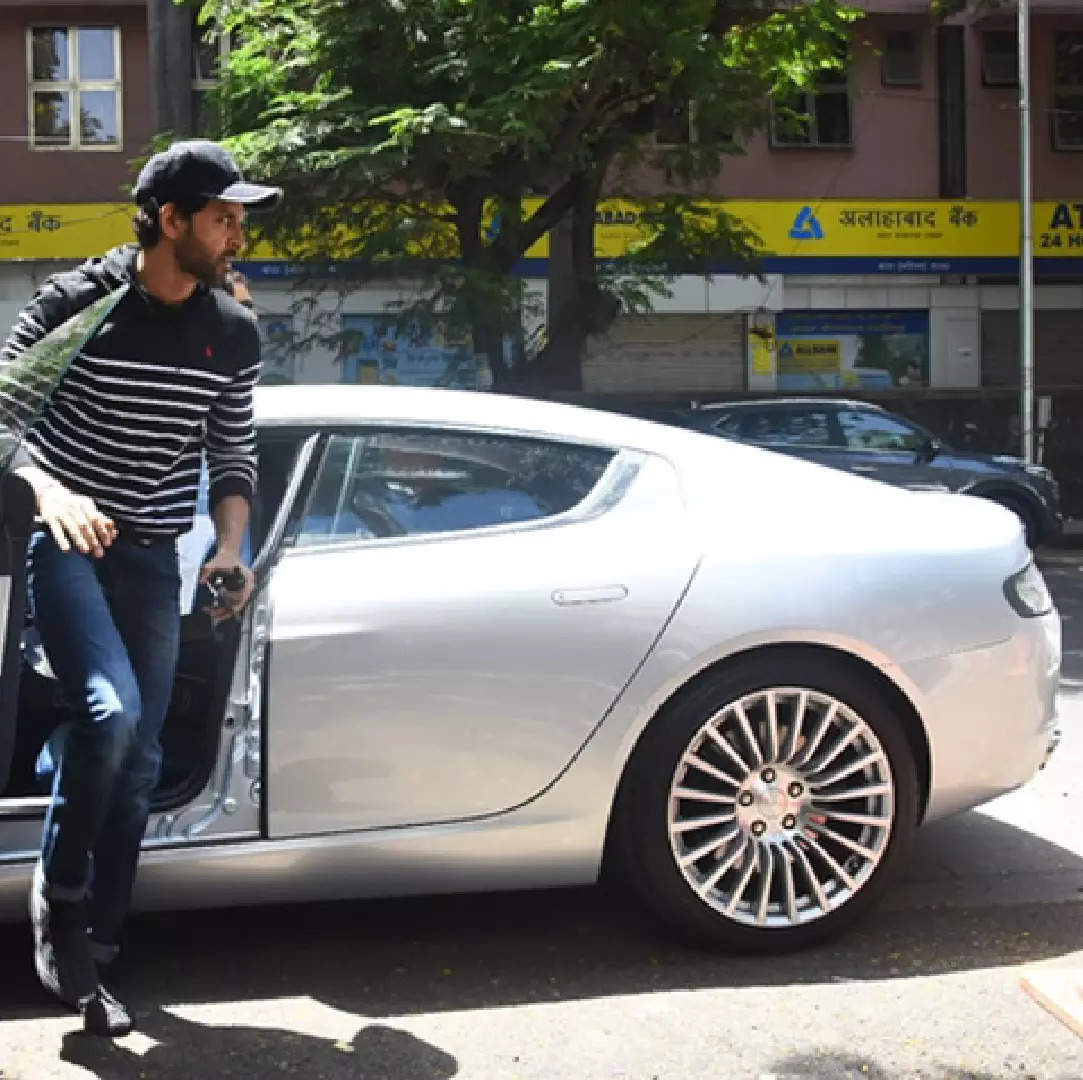 Hrithik Roshan getting out of his Aston Martin Rapide S