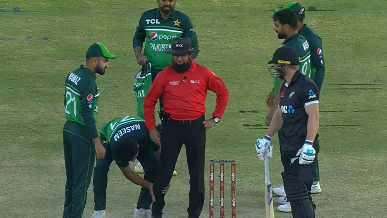 WATCH: Aleem Dar throws player's sweater after being hit by direct throw;  gets massaged by Naseem Shah