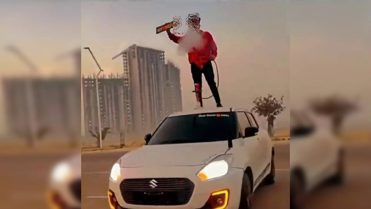 VIDEO Lucknow man caught on camera smoking hookah on roof of car