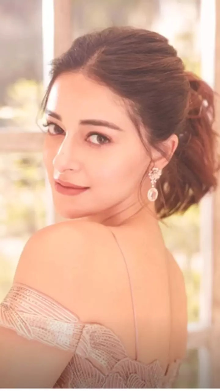 Hotness alert Ananya Panday dazzles in plunging neckline blouse and pleated skirt