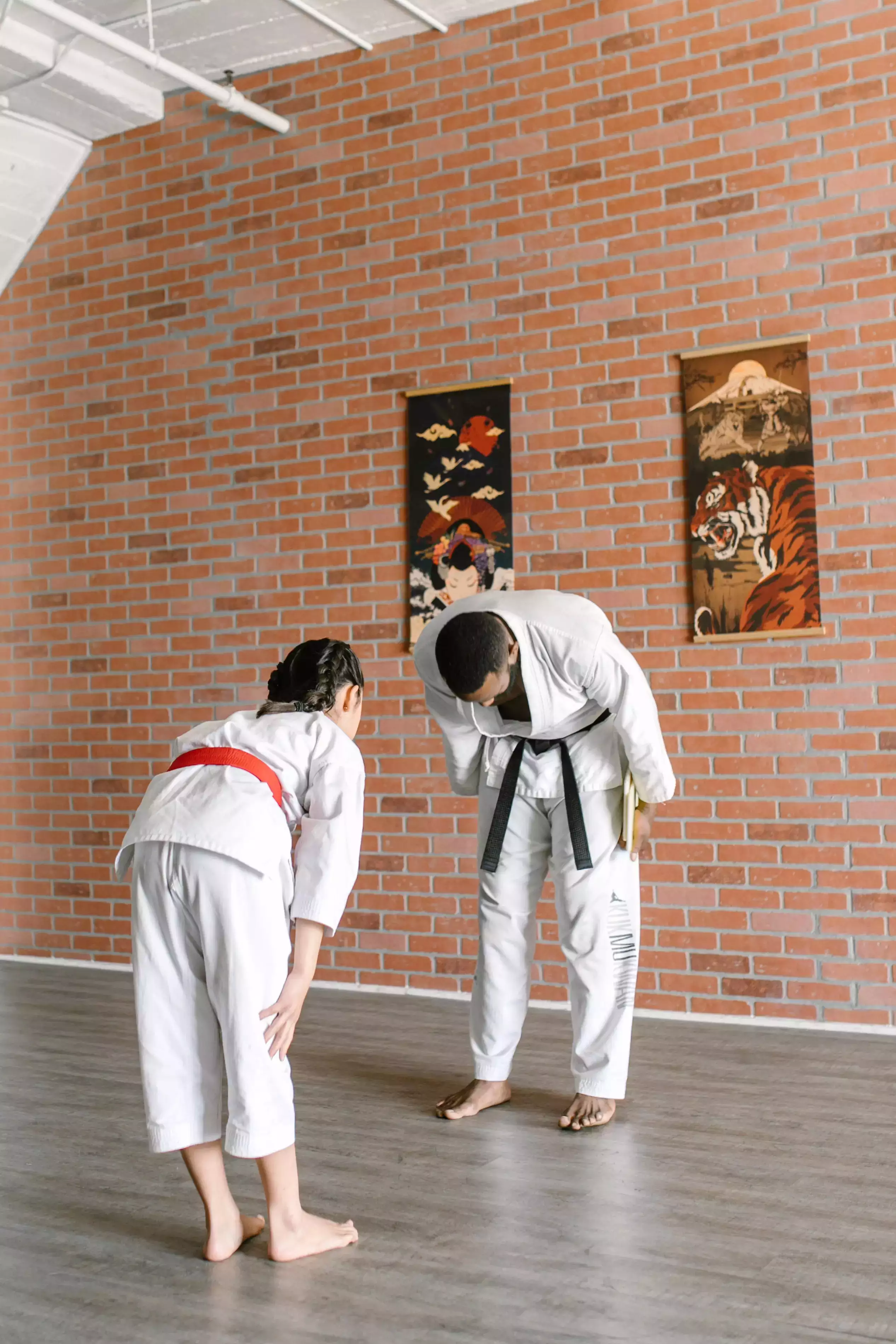 Two people showing respect to each other before a jiu-jitsu match